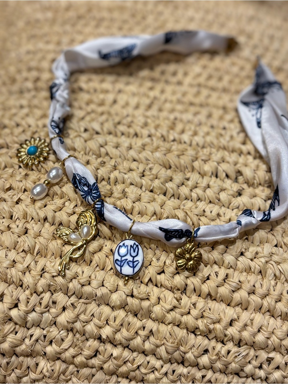 Handmade White and Blue Charm Necklace with Gold Accents